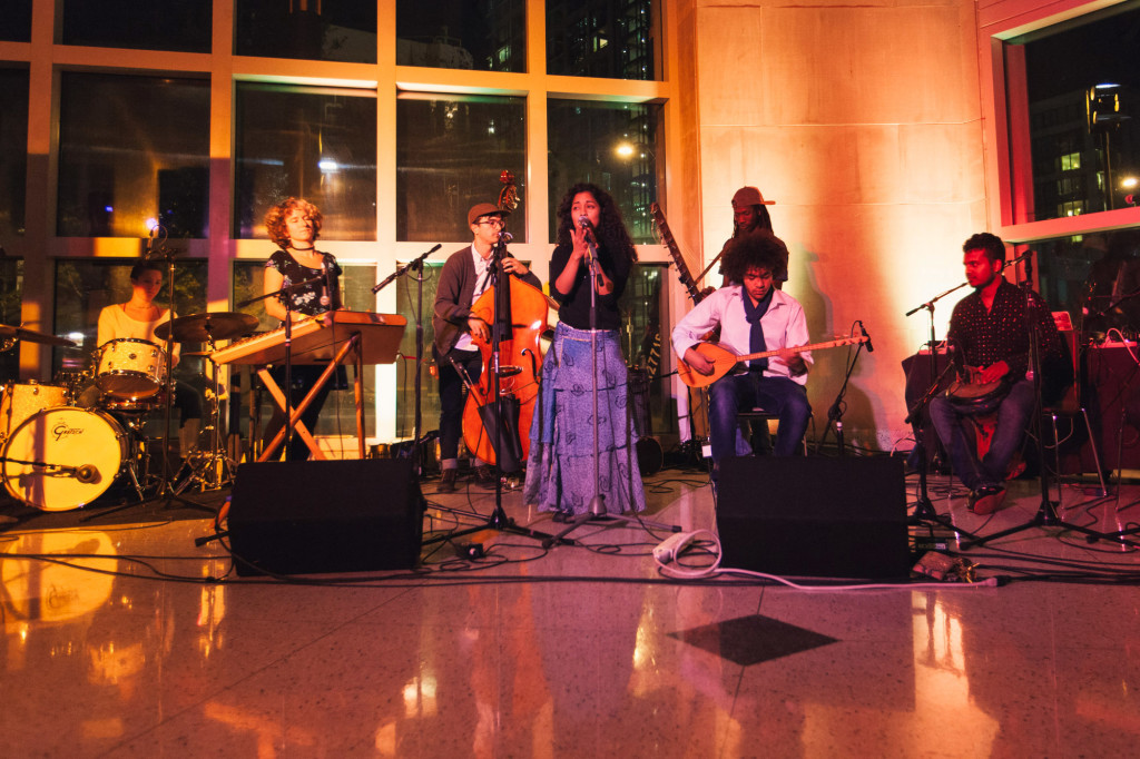 From left to right: Anna Gelyuk on the drums, Christie Burns on the hammer dulcimer, Pat Swoboda on the bass, Eleonora Gotopo Reyes on vocals, Vieux Cissokho on the kora, Abdallah Abozekry on the saz, and Arun Sivag on percussion.