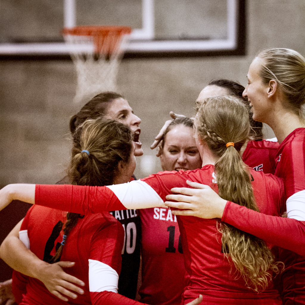 Players congratulate one another on winning a set against New Mexico State University.