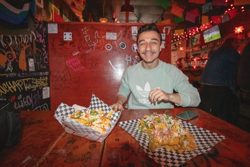 Sami Madani, an El Xolo customer is happy to enjoy his meals of nachos.