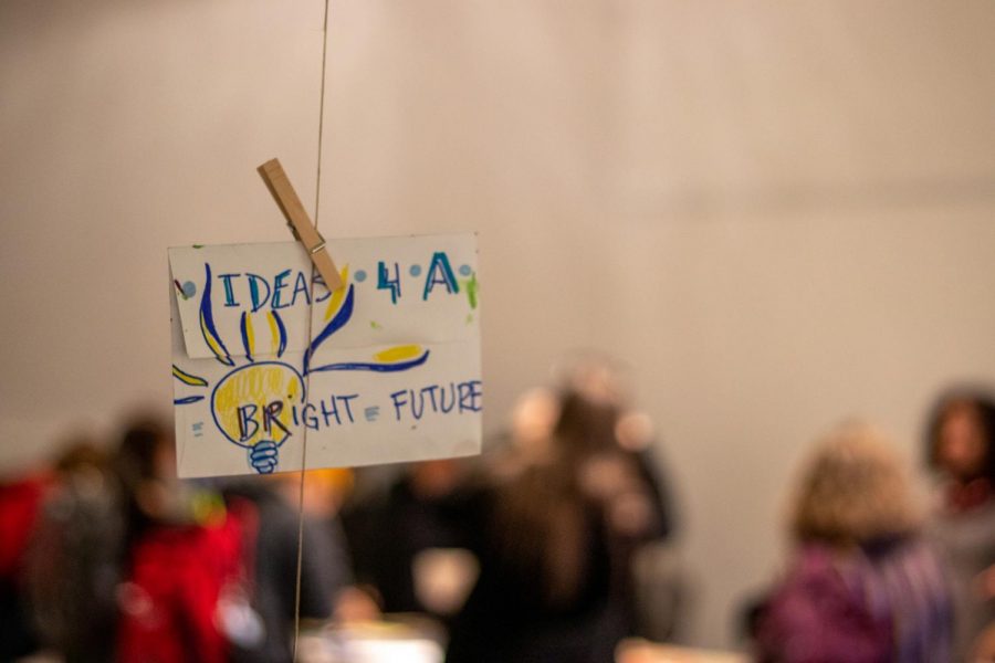 A monoprint reading "Ideas 4 A Bright Future" hanging on a clothesline