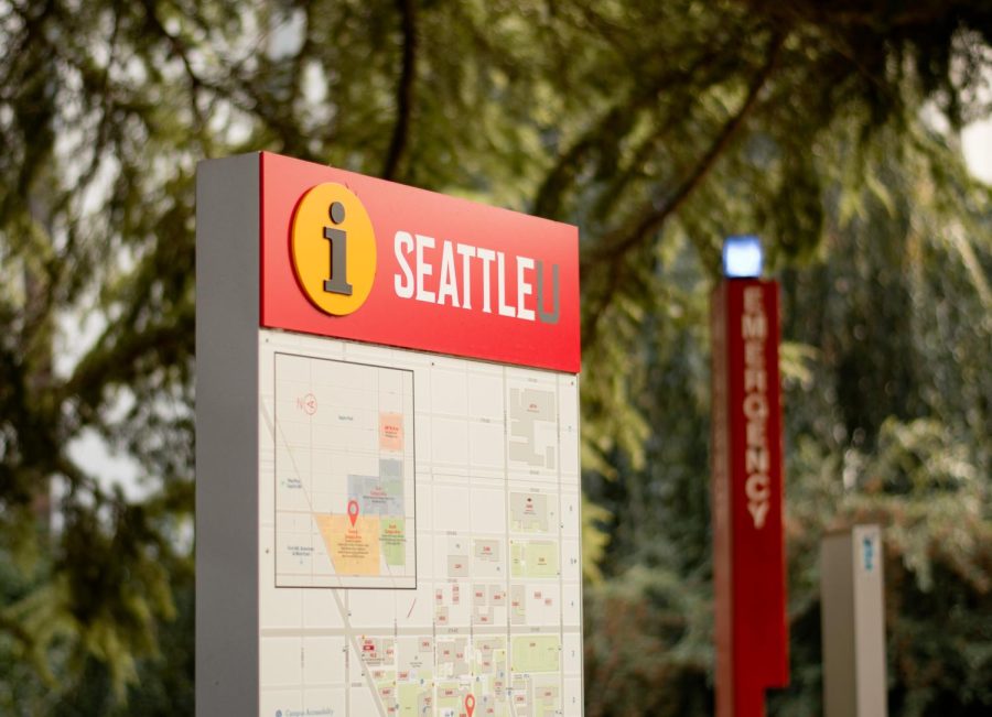 Seattle University information signage near emergency call box pillar. 