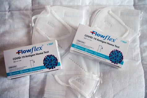Flowflex COVID-19 antigen tests and KN95 masks. 