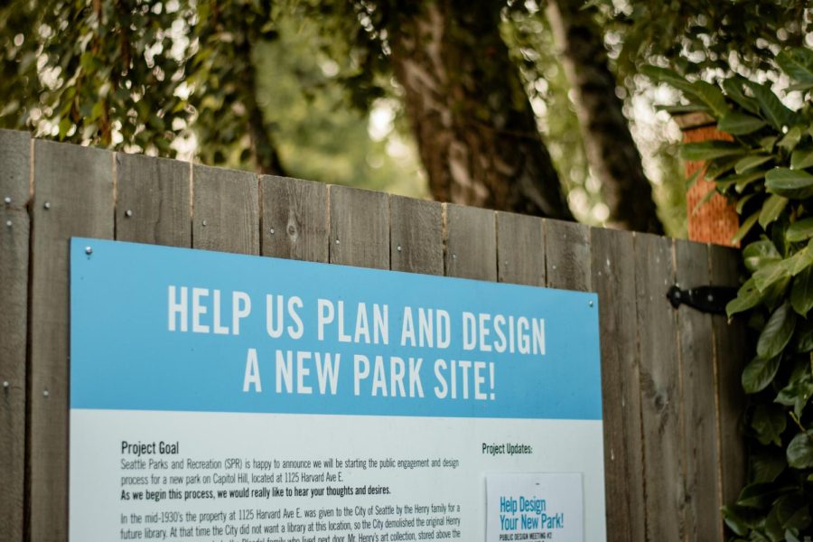 Signage posted to the fence for a new park at 1125 Harvard Ave E.