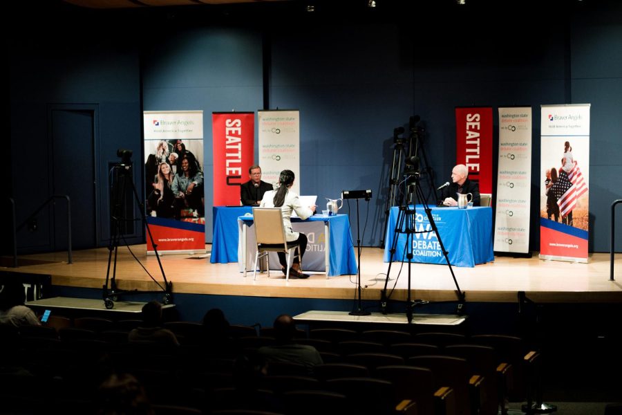 Republican candidate Doug Basler (left) and Democratic incumbent Adam Smith (right) debate at Seattle University.
