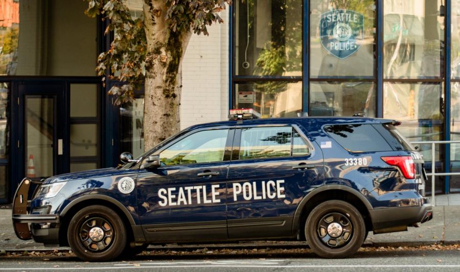 
A Seattle Police department car parked in a reserved spot near the entrance to the East Precinct.