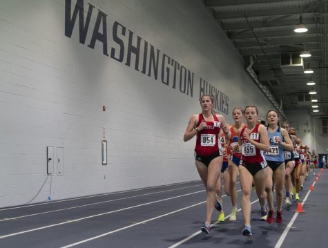 Sophmore Lilianne Hargreaves (left) and junior Emily Harris (right) compete in the 3000 meter dash at the UW Indoor Preview.