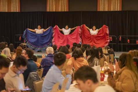 Attendees applaud a performance at the International Dinner. 