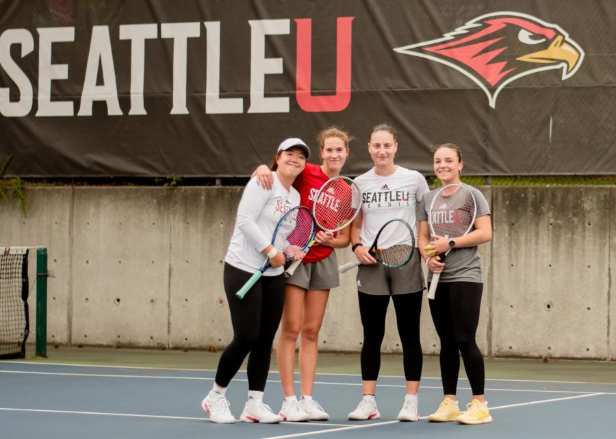Seattle U womens tennis team players pictured on the court.