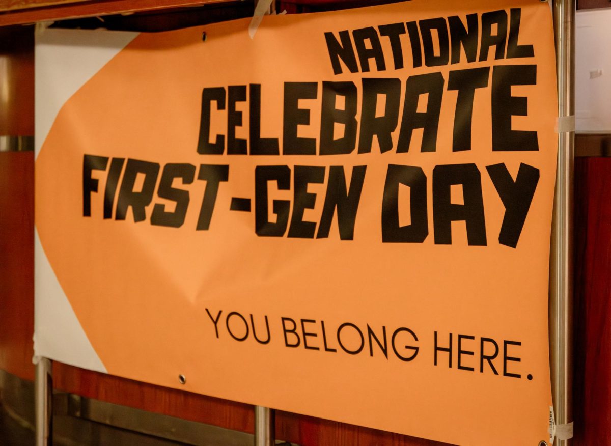 National First-Gen Day signage hung by the HUB Desk on the first floor of the Student Center.