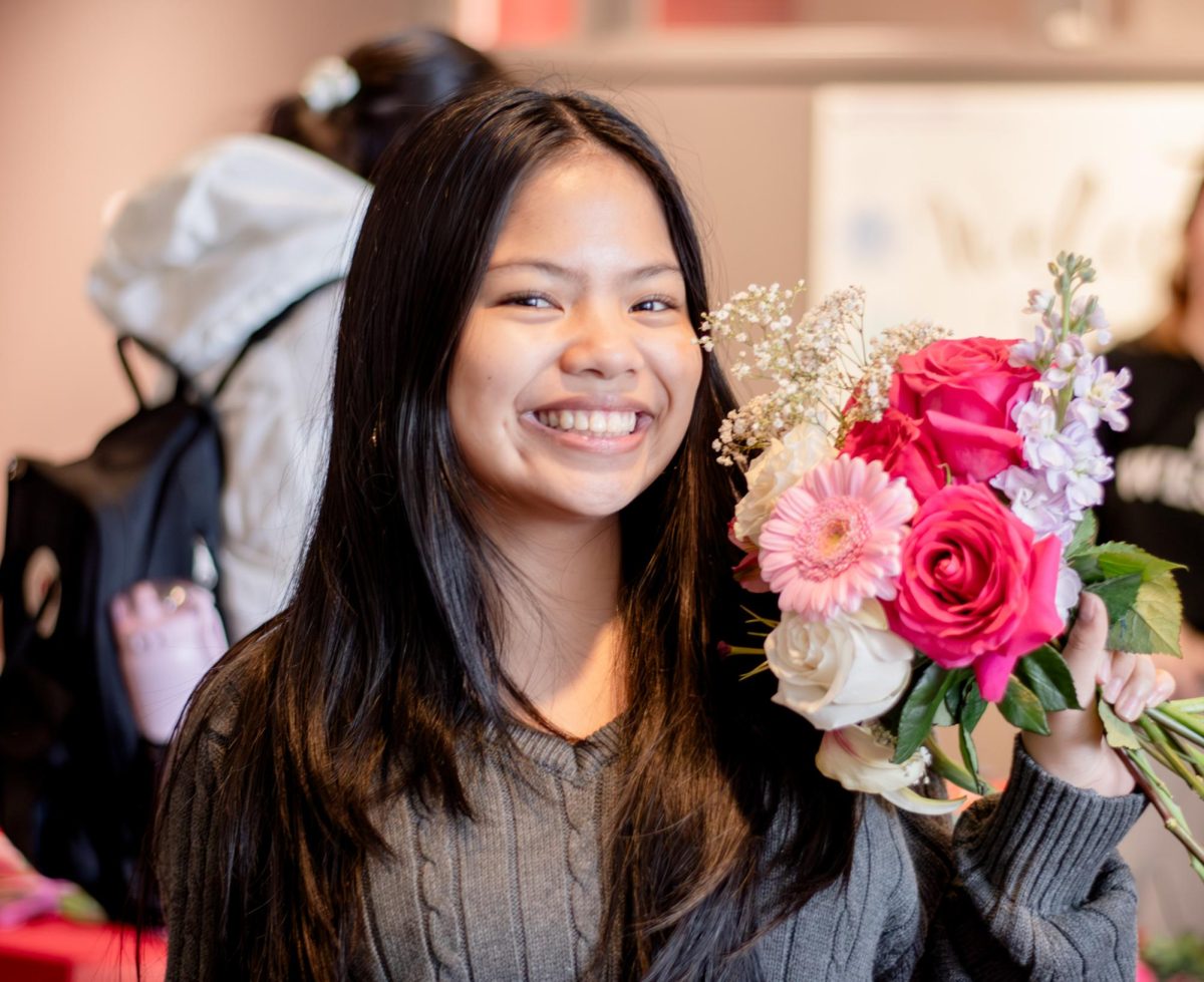 Valentine’s festivities: Lauren Ebia showing her handmade bouquet made during the RedhawkTHON and SEAC bouquet event