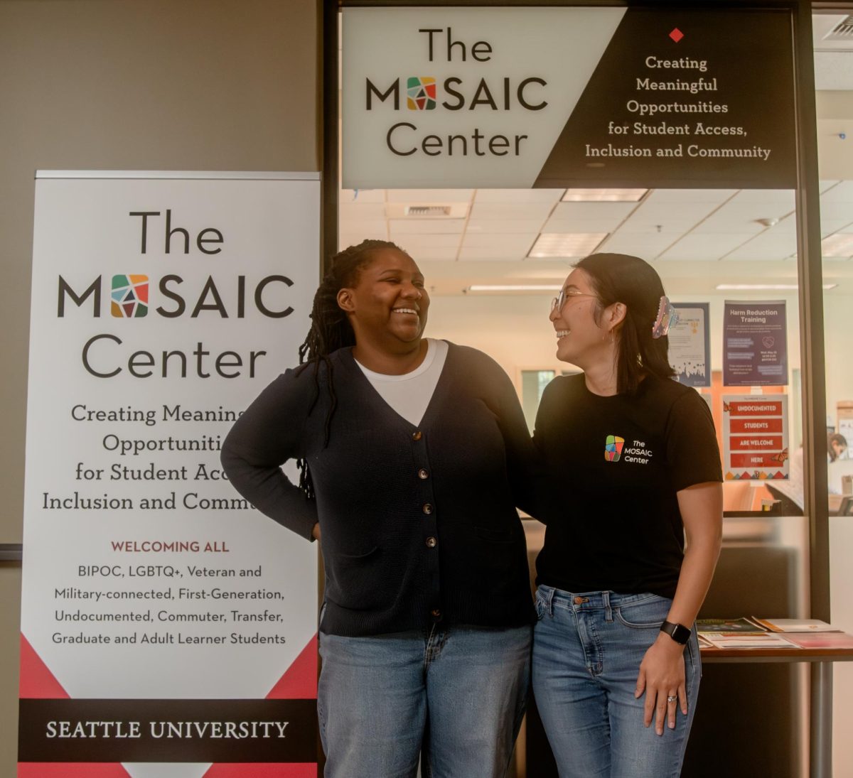 Assistant Director, AshLee Day (they/she), and Director, Michelle Kim (she/her), pictured outside the MOSAIC Center on campus.