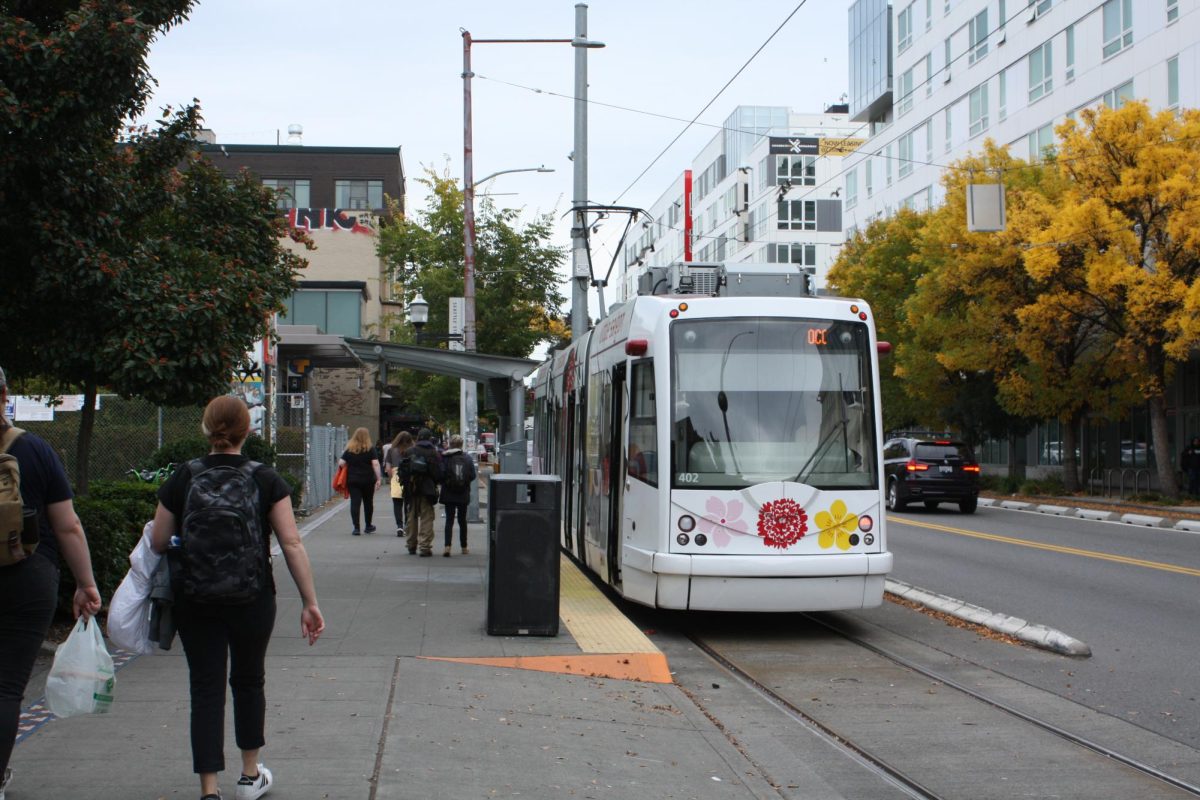 Pedestrians get ready to board the Capitol Hill streetcar on Broadway