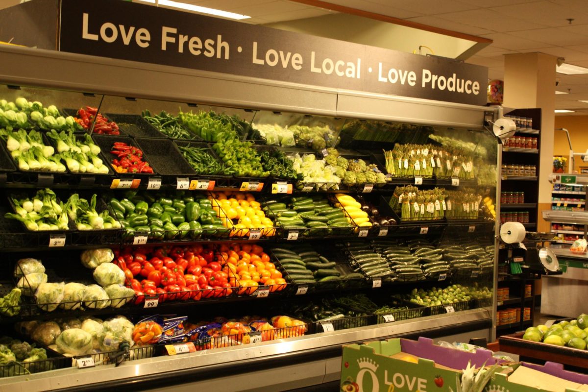 A variety of vegetables perched on display at the end of the QFC produce section.