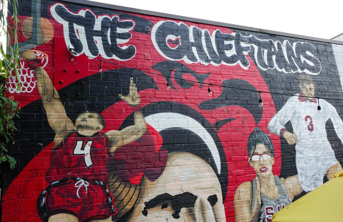 A mural inside The Chieftain Irish Pub, showcasing Seattle University athletes in action—a tribute to the spirited representation of students as the Chieftains.