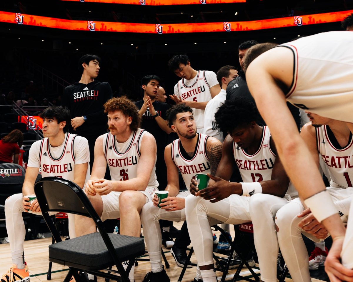 The team discusses strategy during a timeout.