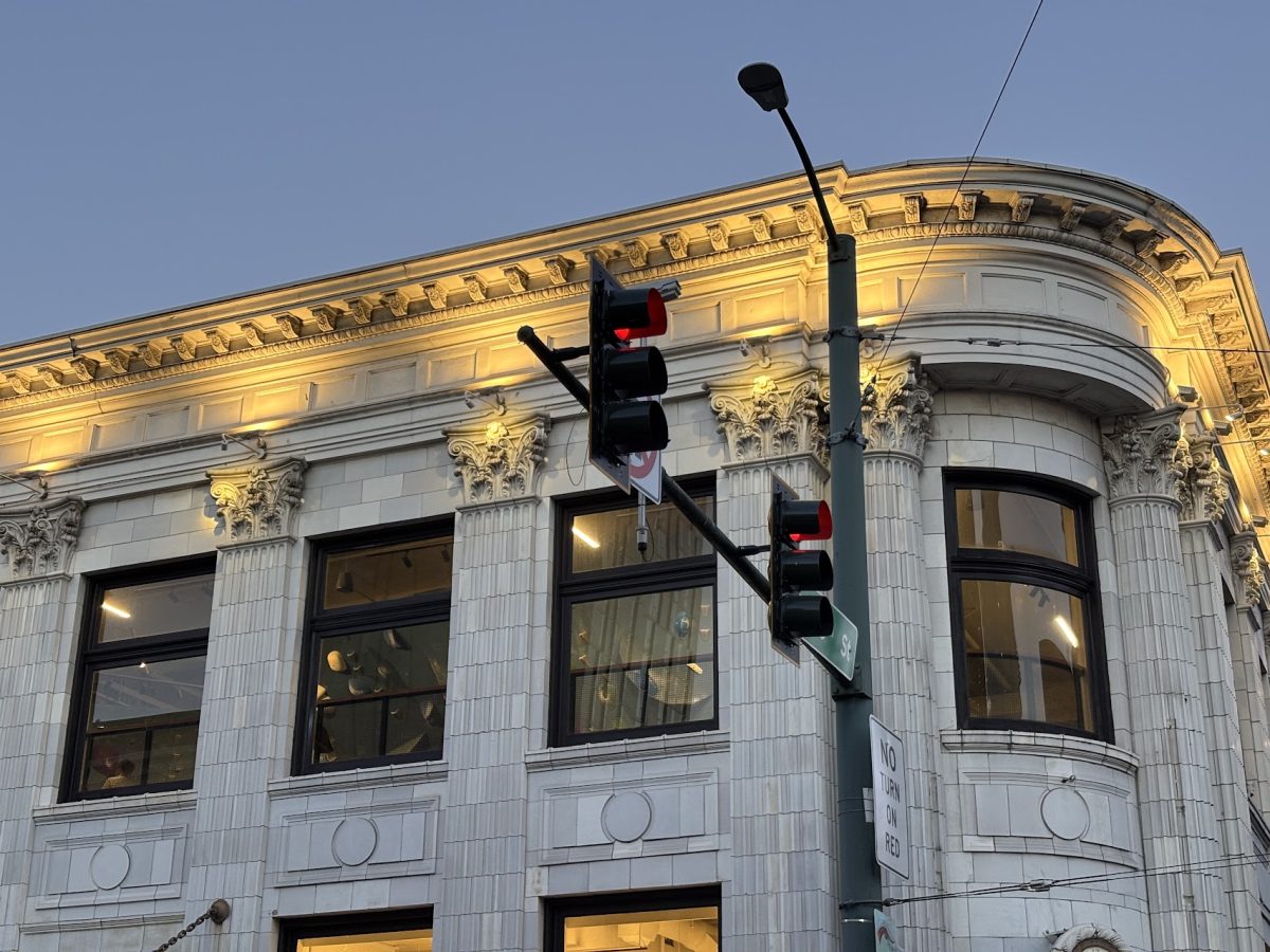 The climbing walls of Seattle Bouldering Project’s newest gym peek through the windows of the University National Bank Building.