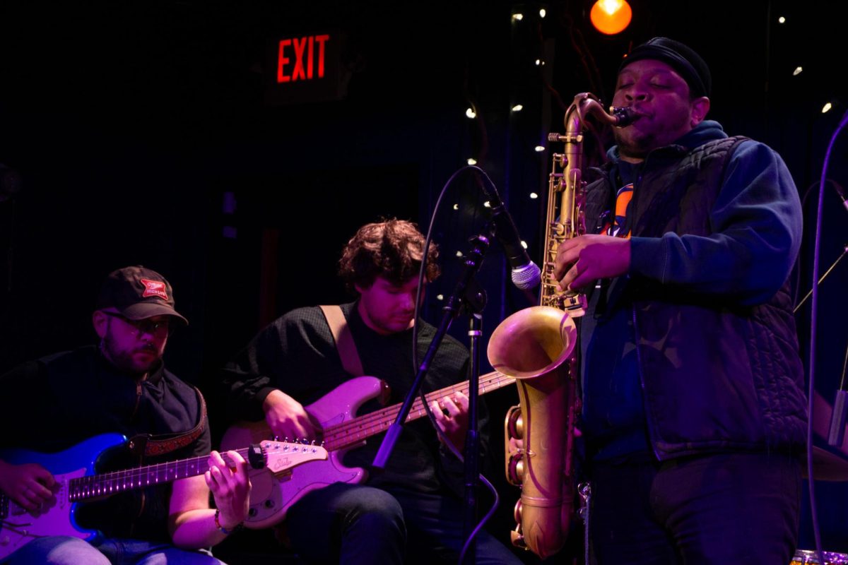 Special guest saxophonist Medearis Dixson plays with a volunteer band.