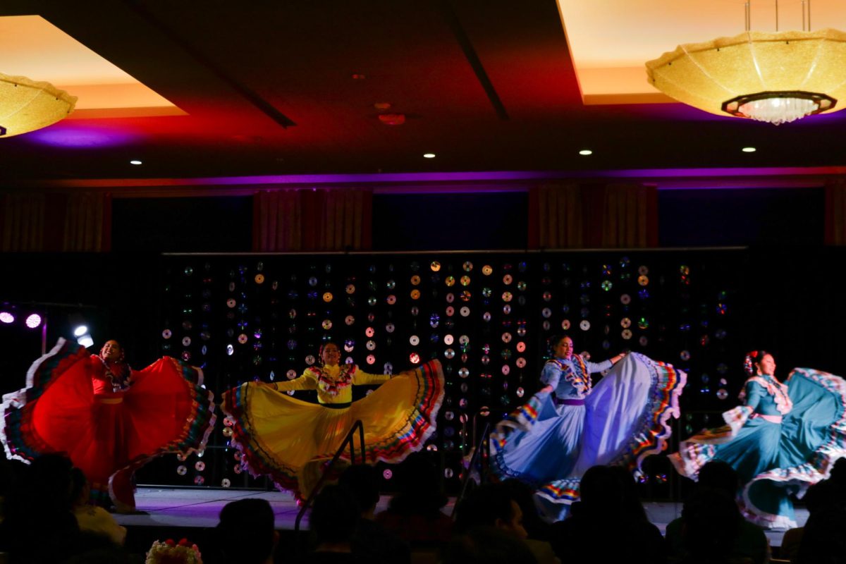 Herencias Mexico group perform together a traditional Mexican folklore dance.