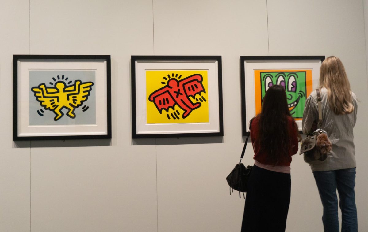 Visitors take in Keith Haring’s iconic characters.