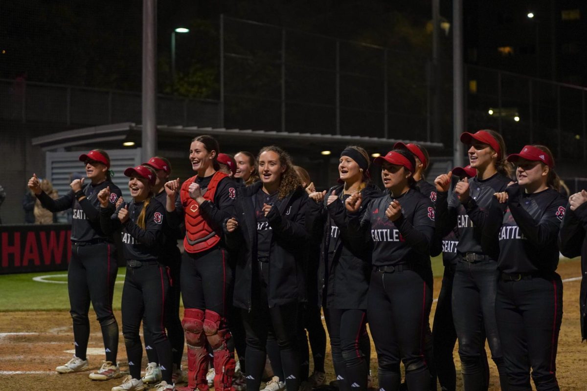 Seattle U softball performs a cheer for the fans after winning the second game of the night.