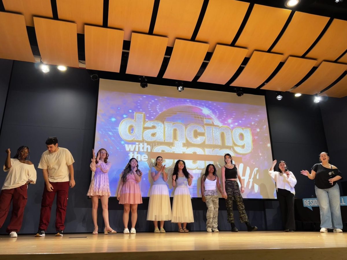 The Four dancing pairs stand on stage during rehearsals.