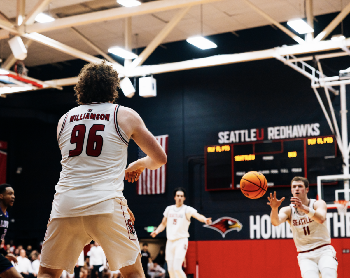 Kobe Williamson passes the ball to John Christofilis.