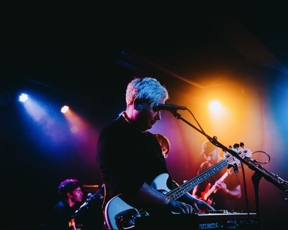 The bassist plays the piano.