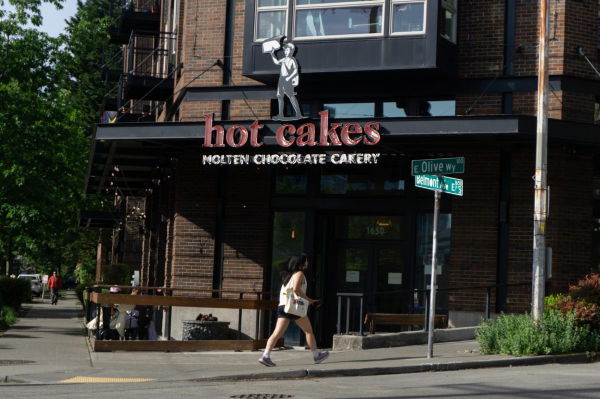 The “Hot Cakes” sign shines bright outside the store.