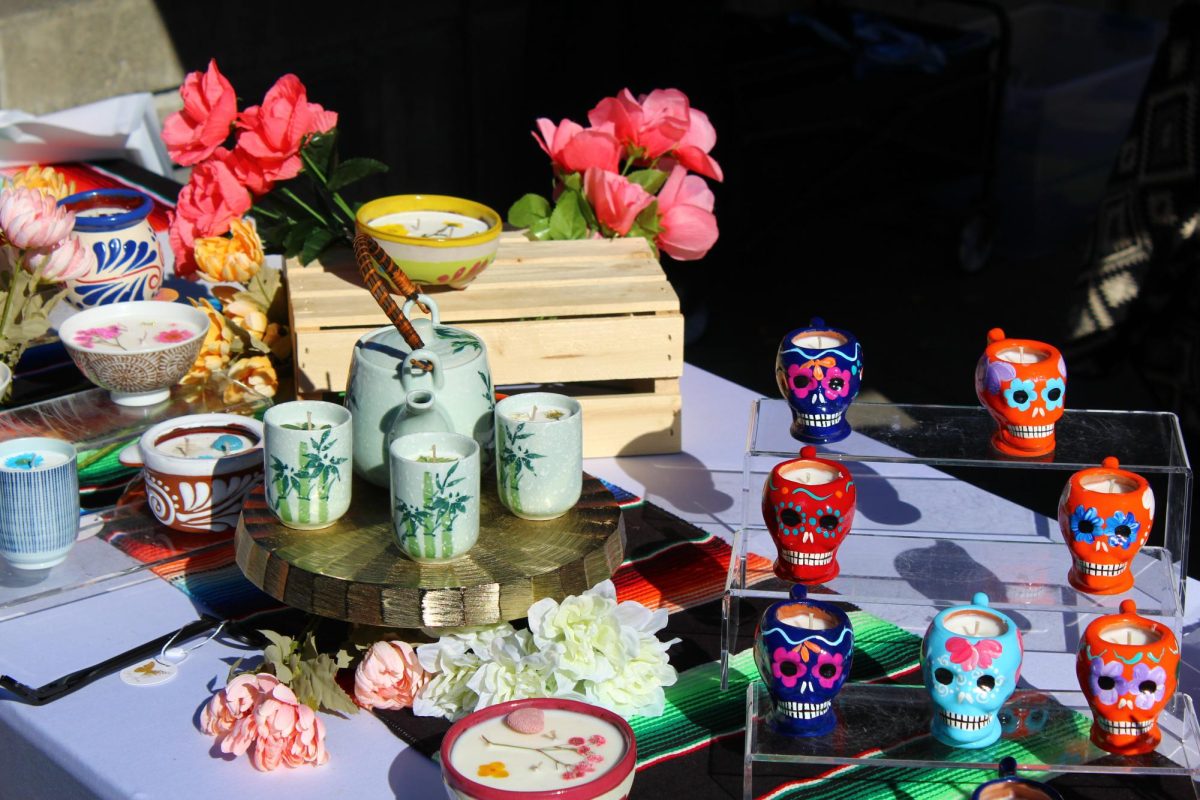  A colorful display of handcrafted candles and ceramics at a Seattle University cultural market.