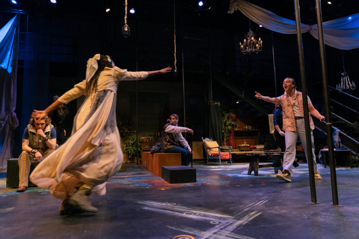Miranda, played by Robin Wangai, runs to Ferdinand, played by Ben Freeman.