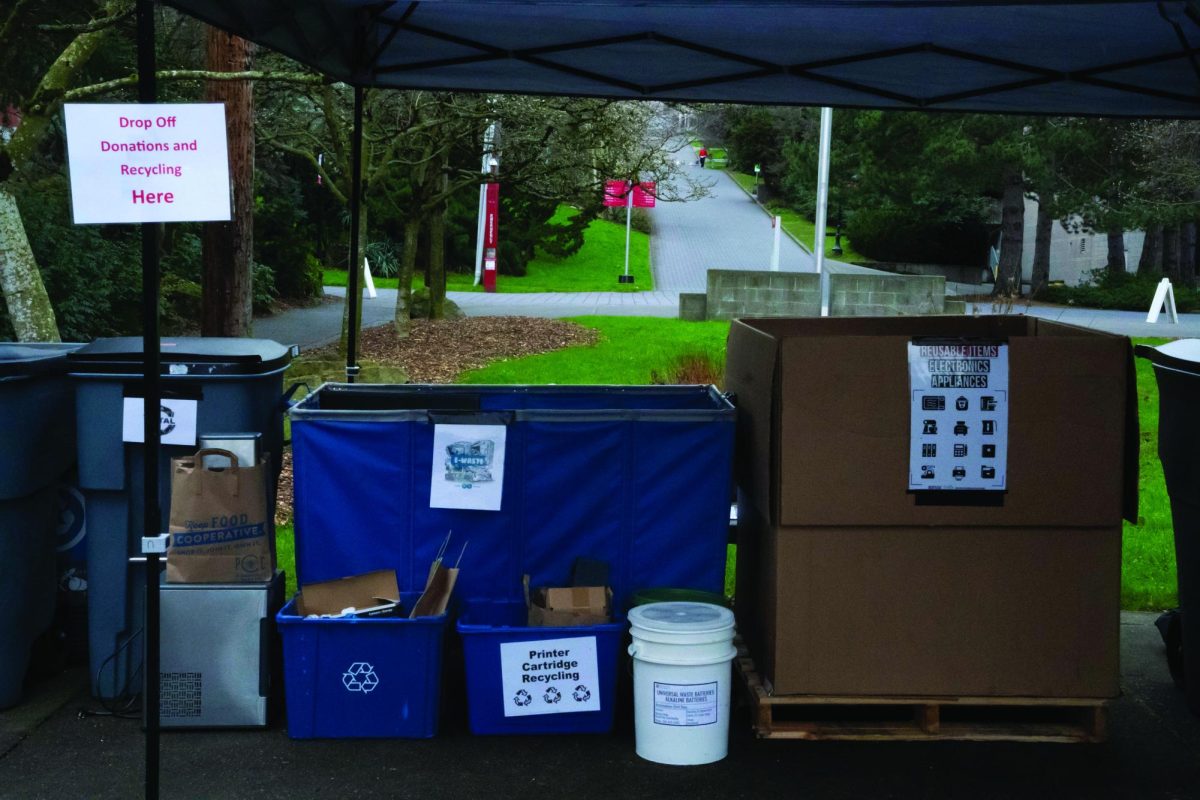 Various trash and recycling bins sit in the Bellarmine turnaround for community recycling day.