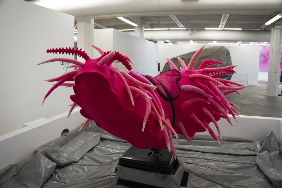 Stefanie Metz’s 10 foot, hot pink nudibranch soft sculpture, “Toxic Beauty”, is housed at Cannonball Arts Center in Downtown Seattle.