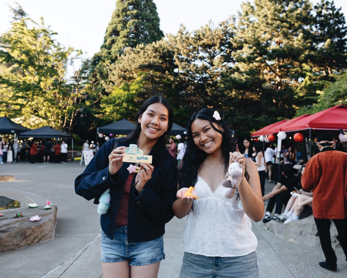 Andrea Lajato ’28 and Margareth Soriano ’28 pose with prizes they won from game booths at Harumatsuri.