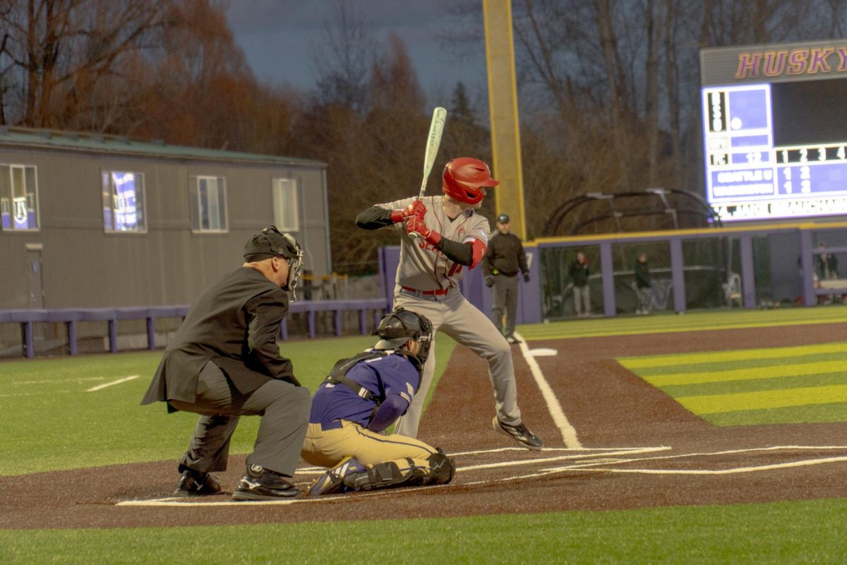Junior outfielder Jake Beauchaine hitting against UW .