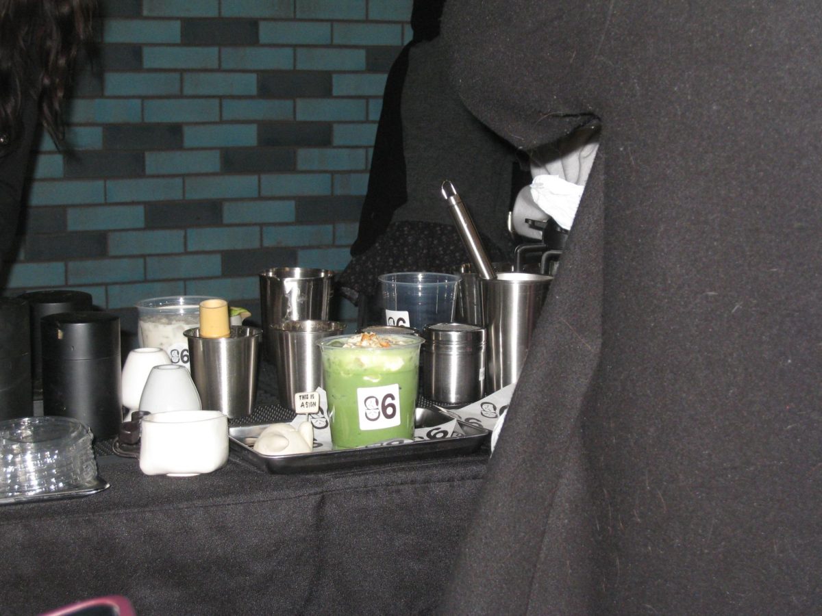 A matcha awaits its eager drinker at CAFE 86 as patrons wait to order.