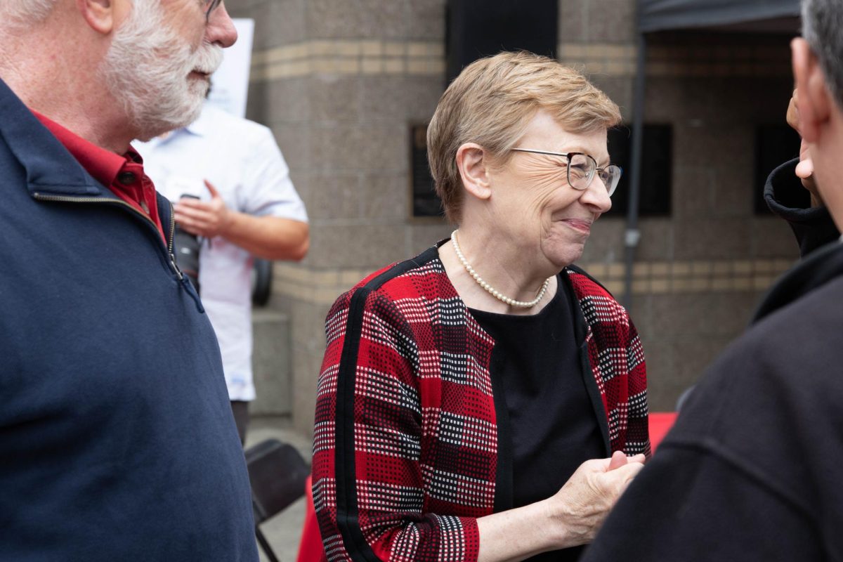 New university president Maura Mast and her husband Scott talk with guests after the event
