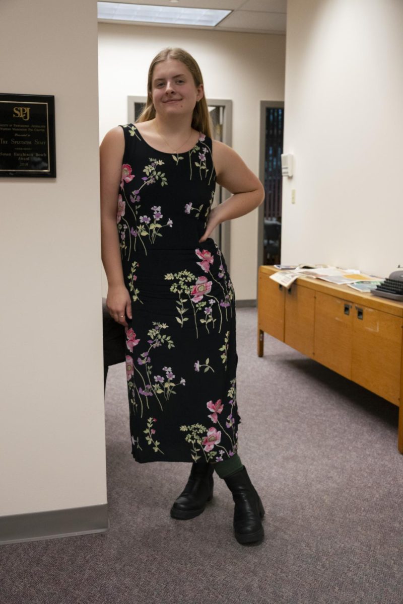 Graduating copy chief, Kaitlyn Delfs, poses for a photo in The Spectator office.