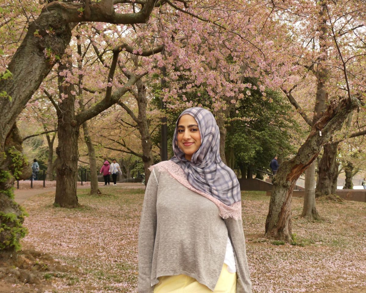 Hadia Ahmed, managing editor, poses among the cherry blossoms in Washington D.C.